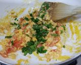 A picture of step 7 of Herby cheese, egg and tomato scramble.