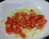 A picture of step 3 of Herby cheese, egg and tomato scramble.