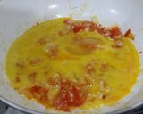 A picture of step 6 of Herby cheese, egg and tomato scramble.