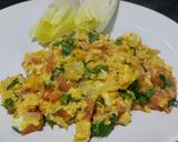 A picture of step 8 of Herby cheese, egg and tomato scramble.