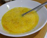 A picture of step 5 of Herby cheese, egg and tomato scramble.