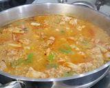 A picture of step 10 of Seafood Paella with Brown Rice.