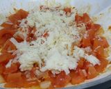 A picture of step 4 of Herby cheese, egg and tomato scramble.