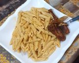 A picture of step 11 of Penne alfredo pasta.