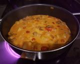 A picture of step 8 of Potato, mushroom and coconut curry pot & coriander tortilla.