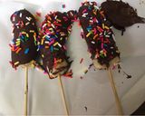 A picture of step 4 of Kids treat frozen chocolate bananas 🍌.