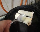 A picture of step 2 of Nuetella and banana french toast roll ups.