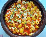 Foto del paso 10 de la receta Gambas al fish masala con patatas confitadas en fumet de gambas