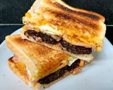 A picture of step 7 of My Smokey Bacon, Black Pudding & fried Egg Toasted Sandwich 🥰.