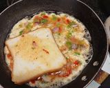 A picture of step 3 of Cheesy omelet with 🍞 bread.