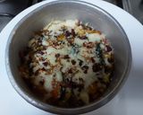 A picture of step 3 of Spinach/ corn with white sauce baked.