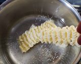 A picture of step 1 of Maggi peanut cracker in potato boat.