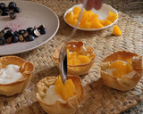 Foto del paso 9 de la receta: Tartaletas con yogur, melocotón y arándanos