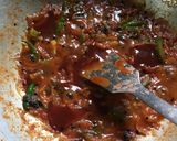 A picture of step 6 of Chatpata Bread Upma in red sauce.
