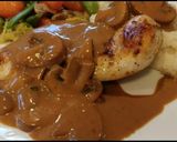 A picture of step 8 of Pan Seared Chicken Breast smothered in a Crimini Mushroom Sauce.
