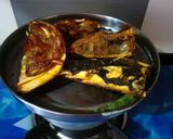 A picture of step 3 of Muri Ghonto (Fish head curry with lentils).