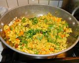 A picture of step 3 of Upma with puffed rice and colorful veggies.