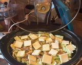 A picture of step 2 of Slow Cooker Cajun Sausage and Potatoes (serve over rice).