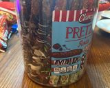 A picture of step 7 of Christmas chocolate covered pretzel rods.
