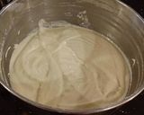 A picture of step 5 of Vanilla Layer Cake with Lemon Cream Filling and Lemon Whipped Cream Frosting.