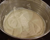 A picture of step 5 of Vanilla Layer Cake with Lemon Cream Filling and Lemon Whipped Cream Frosting.