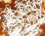 A picture of step 12 of Cheesy crust veg Pizza in tawa.