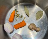 A picture of step 1 of Cook every part - Chicken broth (with some meat) from chicken back/carcass, and wing tips.