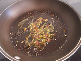 Pasta in spicy chorizo tomato sauce with capers