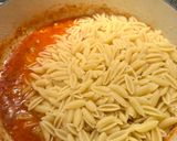 A picture of step 6 of Malloreddus alla Campidanese (pasta with saffron, tomato and pork sausage ragù).