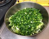 A picture of step 4 of Juicy Pan-Fried Dumplings with Napa Cabbage and Garlic Chives.