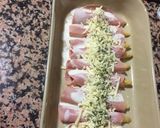 Foto del paso 3 de la receta: Espárragos envueltos con jamón y queso gratinado