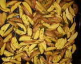 A picture of step 3 of Baked rosemary potatoe wedges.