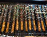 A picture of step 5 of Christmas chocolate covered pretzel rods.