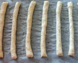 A picture of step 3 of Cacio and pepe breadsticks with prosciutto and goat's cheese.
