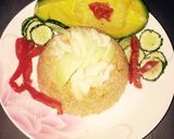 Foto del paso 2 de la receta: Arroz amarrillo con cebolla, pepino, tomate y aguacate