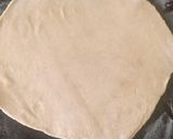 A picture of step 6 of Cheese stuffed paratha with smile emoji.