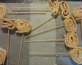 Foto del paso 3 de la receta: Piruletas de hojaldre, jamón y queso