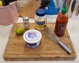 A picture of step 1 of Garlic Lime Crema Seafood Taco Sauce.