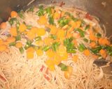 A picture of step 4 of Stir fried pasta with smoked fish.