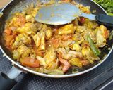 A picture of step 5 of Chicken Masala curry.