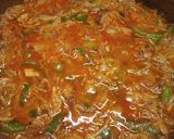 A picture of step 2 of Spanish chicken with browned rice.