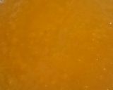 A picture of step 15 of Vanilla tutti fruity cake with Mango topping.