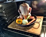 A picture of step 4 of Beer Can Chicken in an oven!.