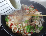 Foto del paso 8 de la receta: Arroz de calamares y alcachofas 🦑