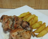 Foto del paso 5 de la receta: Conejo asado con gajos de patata