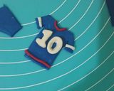 A picture of step 8 of Cricket 🏏 theme cake.