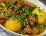 A picture of step 5 of Alo gosht.