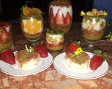 A picture of step 14 of Kunafa and Qashtalia Decorated with Oranges, Strawberries, and Bananas.