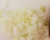 A picture of step 2 of Corned Beef Hash with a fried egg on top.