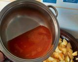Foto del paso 7 de la receta Gambas al fish masala con patatas confitadas en fumet de gambas